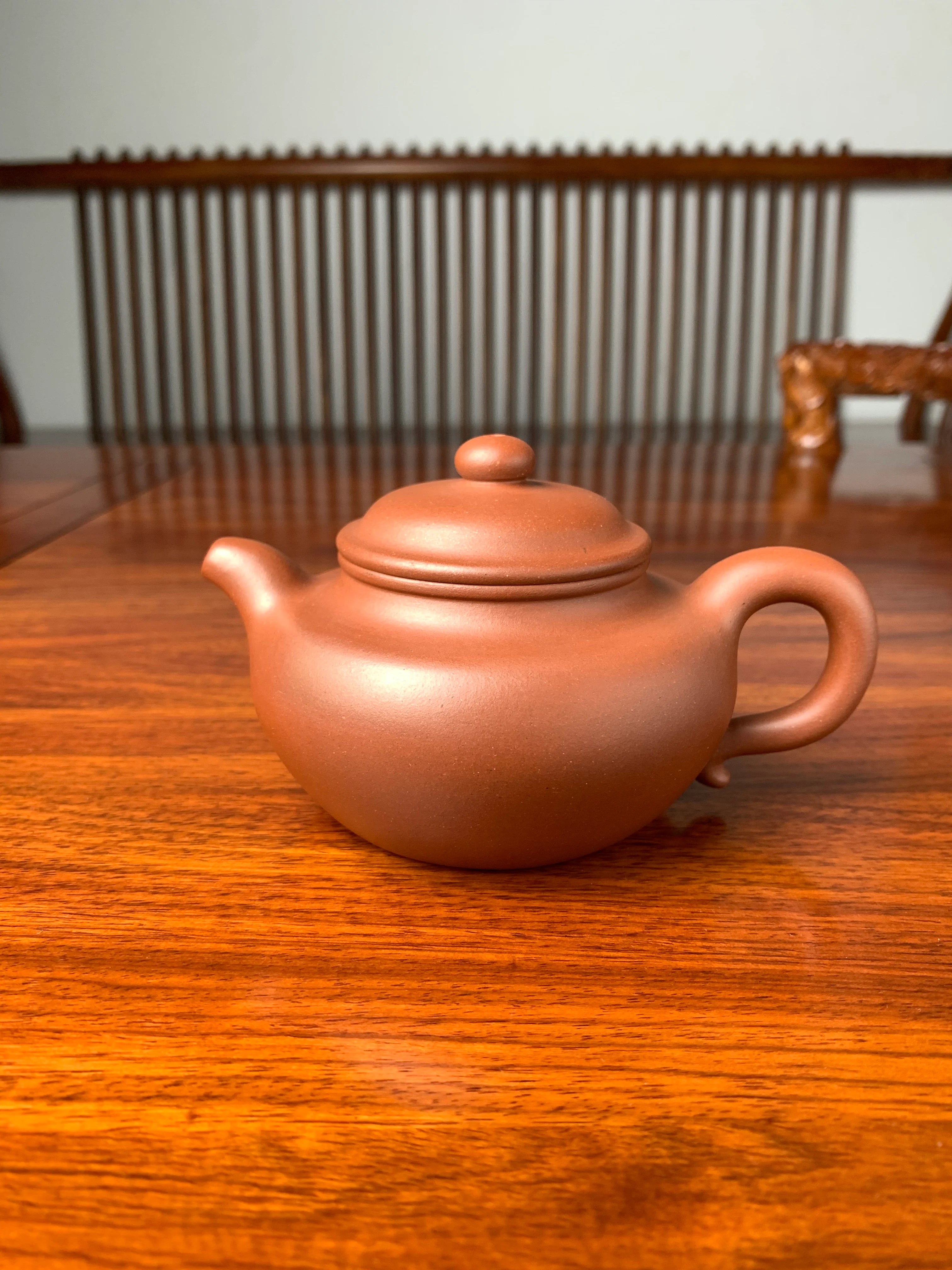 handmade yixing teapot named fang gu on the table